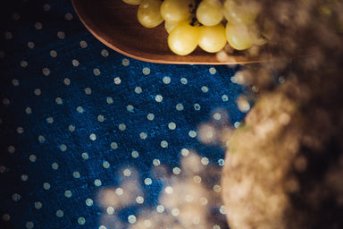 Antique handwoven Hungarian hemp table cloth with wax resist indigo dye and grapes.