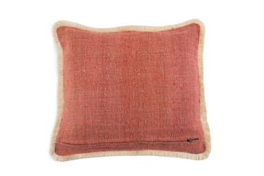 Handwoven antique Hungarian hemp pillow with red back and cotton fringe.