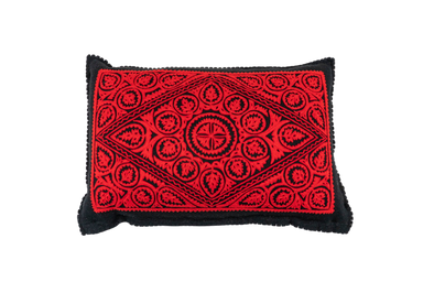 Antique handwoven Hungarian wool pillow with vibrant red and black pattern.