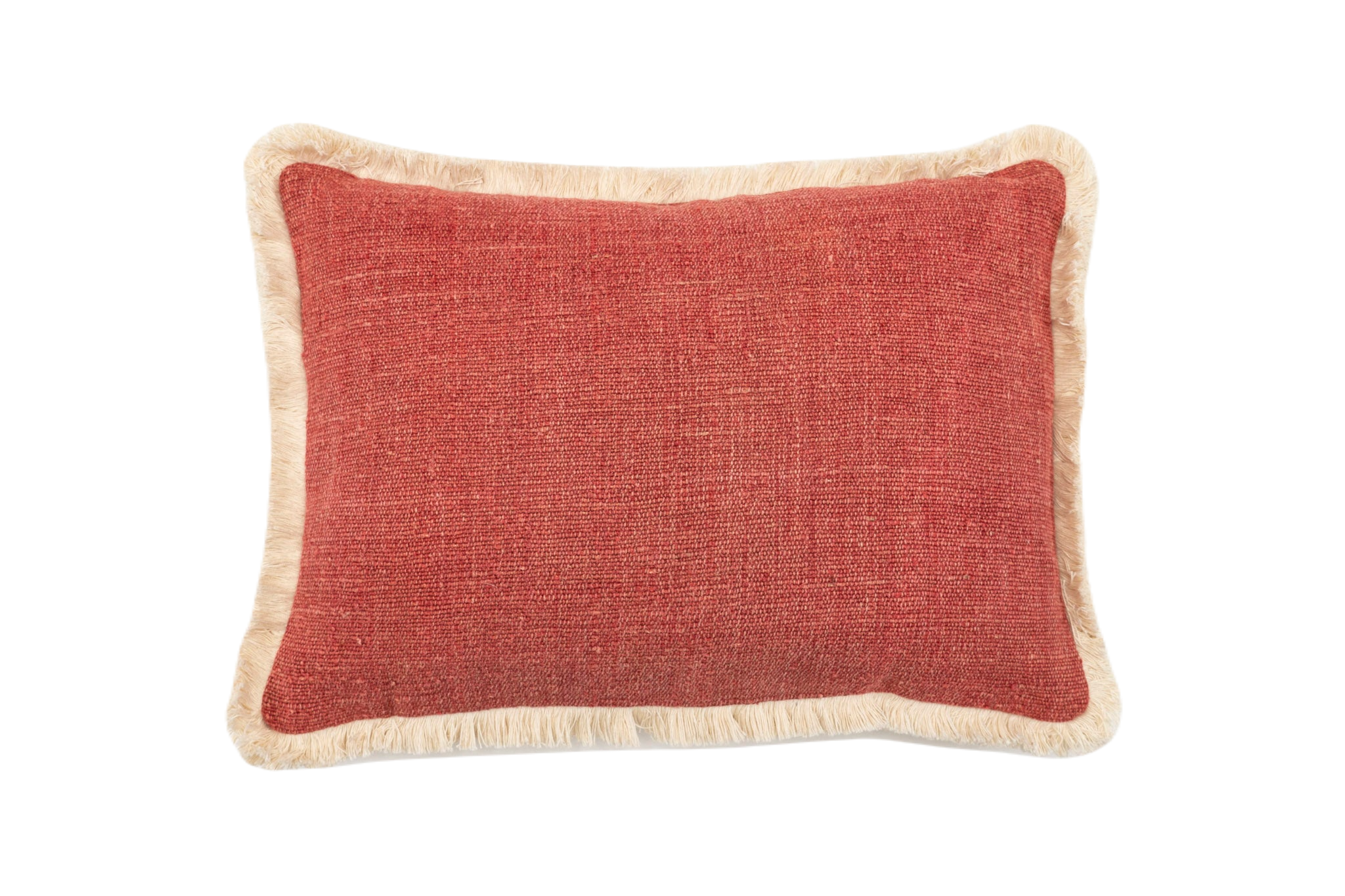 Handwoven antique Hungarian hemp pillow with red fabric and fringed edges.