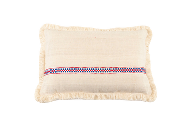 Handwoven antique Hungarian hemp pillow with decorative pattern and cotton fringe.